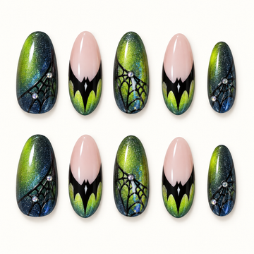 Venom Web press-on nail set with black web-inspired details, green shimmer, and nude-pink accents on a neutral background