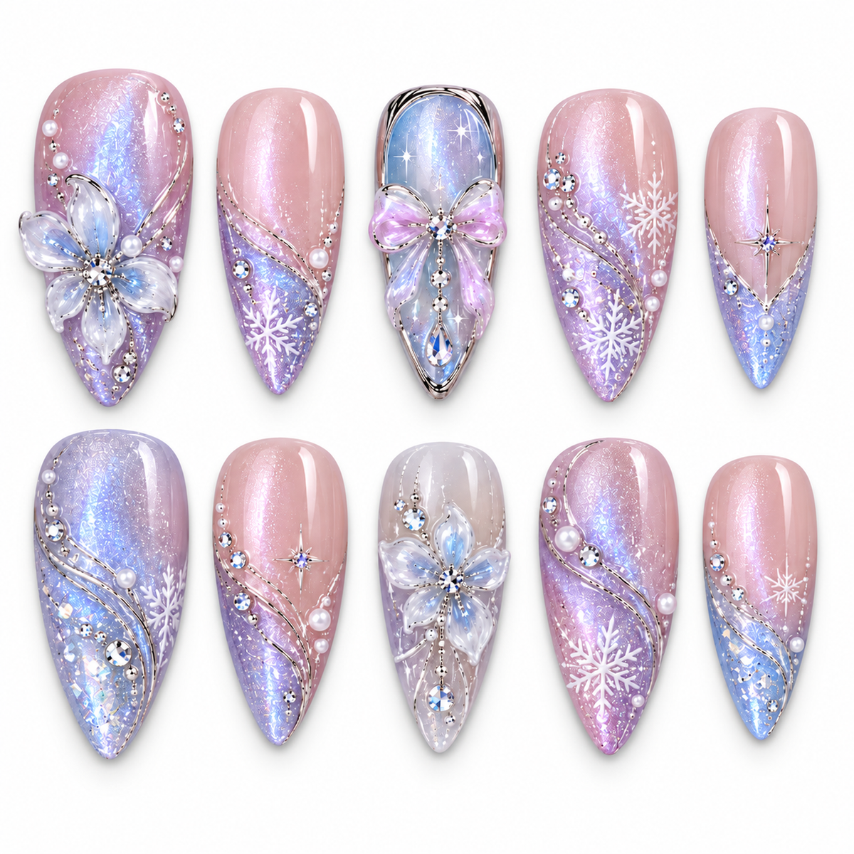 Ten pastel nails arranged in two rows on a light background, featuring pink and blue shimmer, white snowflakes, dimensional flowers, and a lavender bow.
