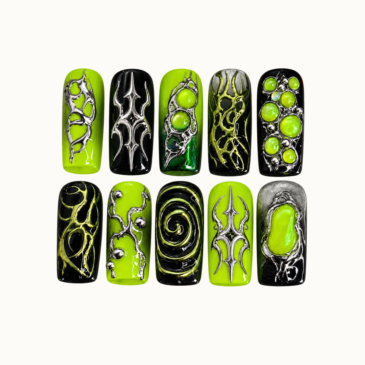Ten lime-green and black nails arranged in two rows on a light neutral background, with silver-toned points, green bubbles, branching patterns, and a spiral.