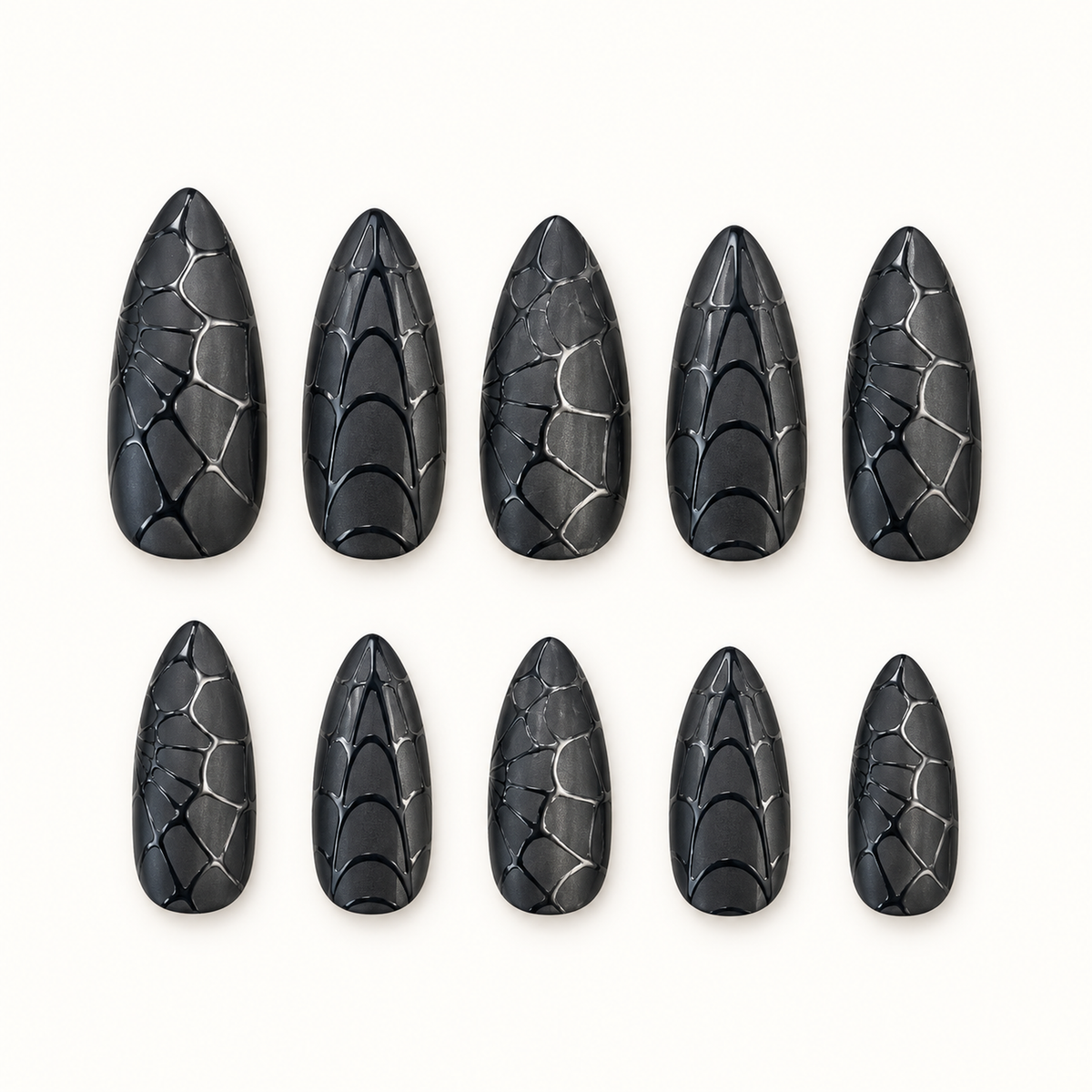 Midnight Web black dimensional nails arranged to show layered web-inspired texture.