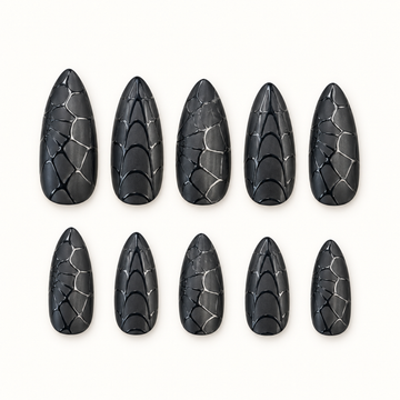 Midnight Web black dimensional nails arranged to show layered web-inspired texture.