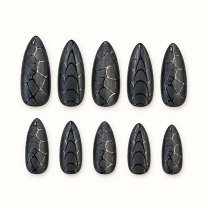 Midnight Web black dimensional nails arranged to show layered web-inspired texture.