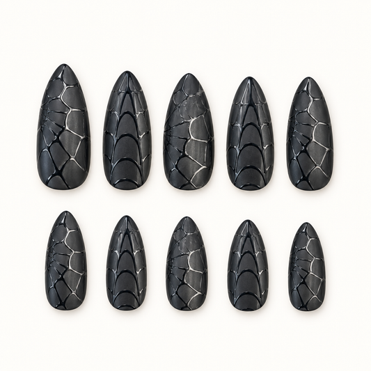 Midnight Web black dimensional nails arranged to show layered web-inspired texture.