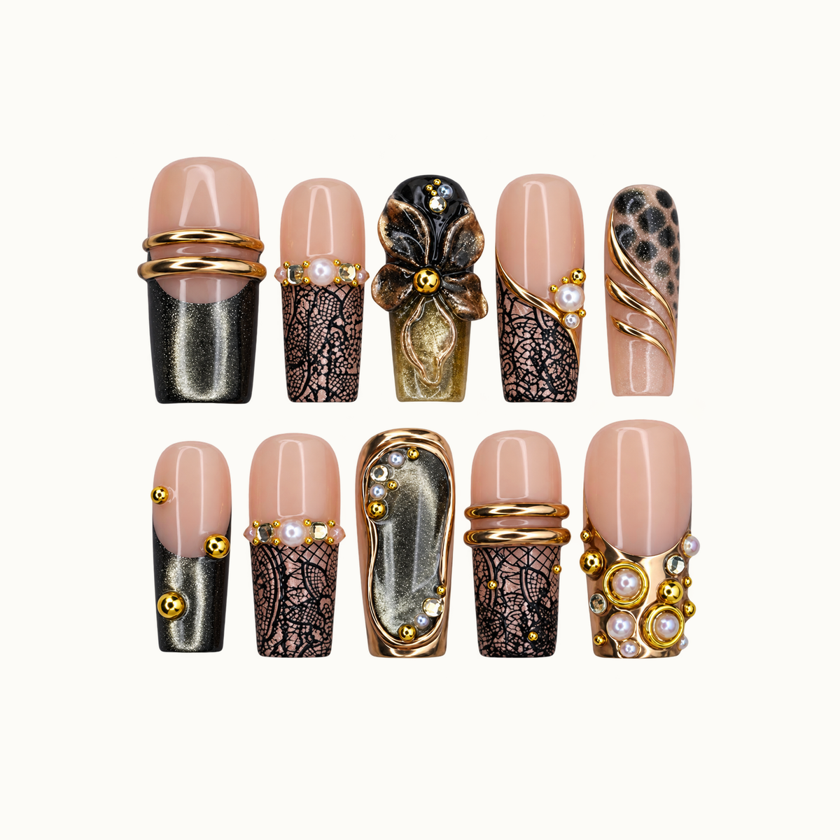 Ten coordinated nude pink nails arranged in two rows, featuring black lace-like patterns, smoky shimmer, gold-tone bands, pearl-like accents, and a raised dark flower.