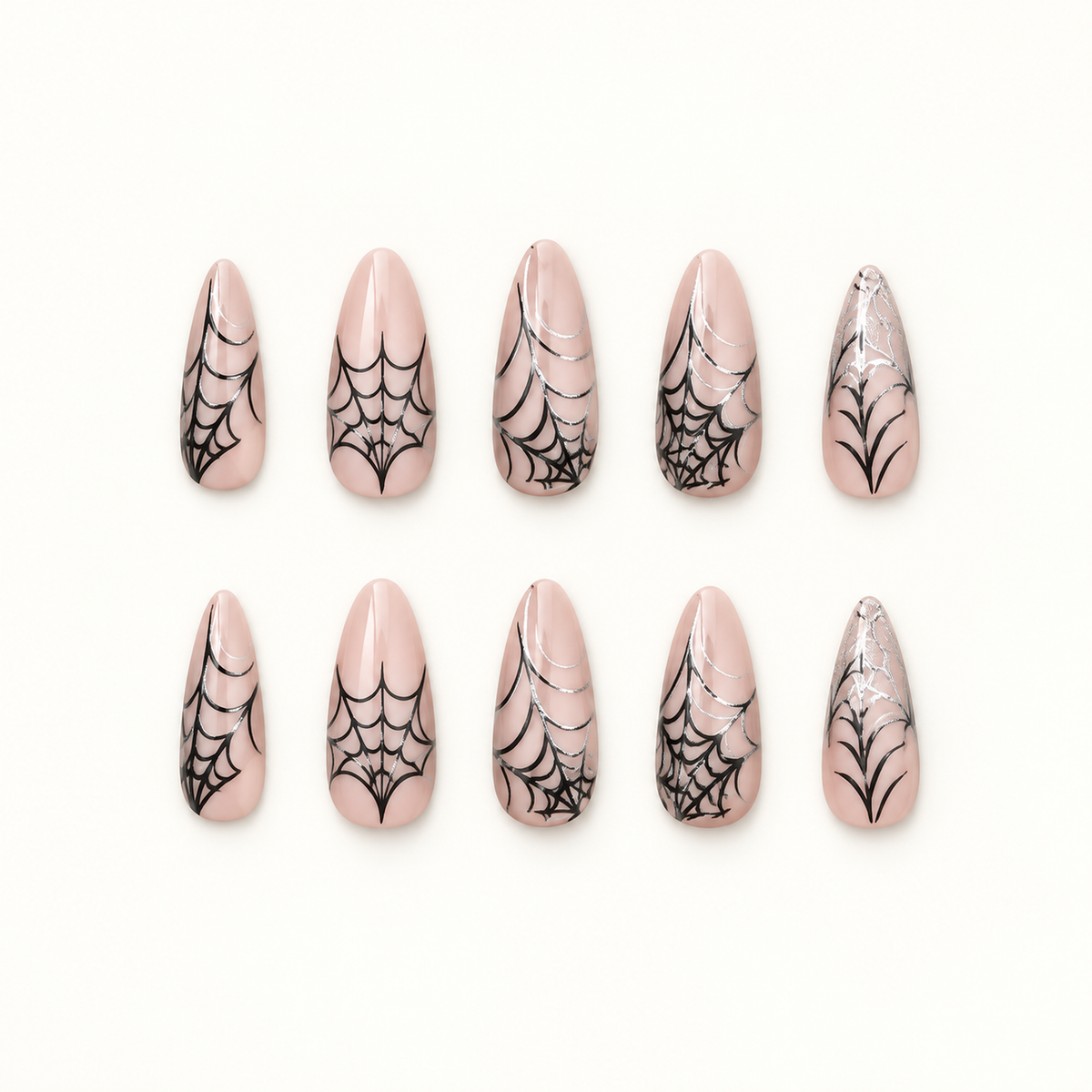 Midnight Webline press-on nails on a neutral background, showing nude bases, black spiderweb line art, and graphic tip accents.