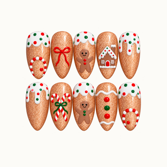 Ten caramel-brown nails arranged in two rows on a light neutral background, decorated with white icing, gingerbread figures, a house, bows, and candy canes.