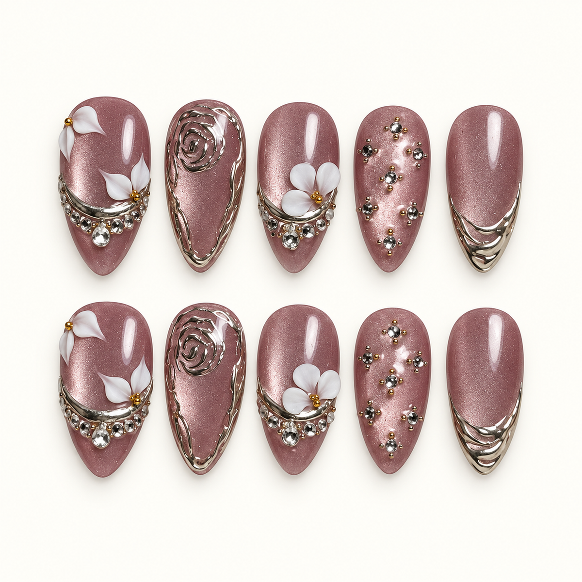 Ten mauve shimmer nails arranged in two rows on a light background, with white flowers, silver-toned rose outlines, curved tip bands, and clear gems.