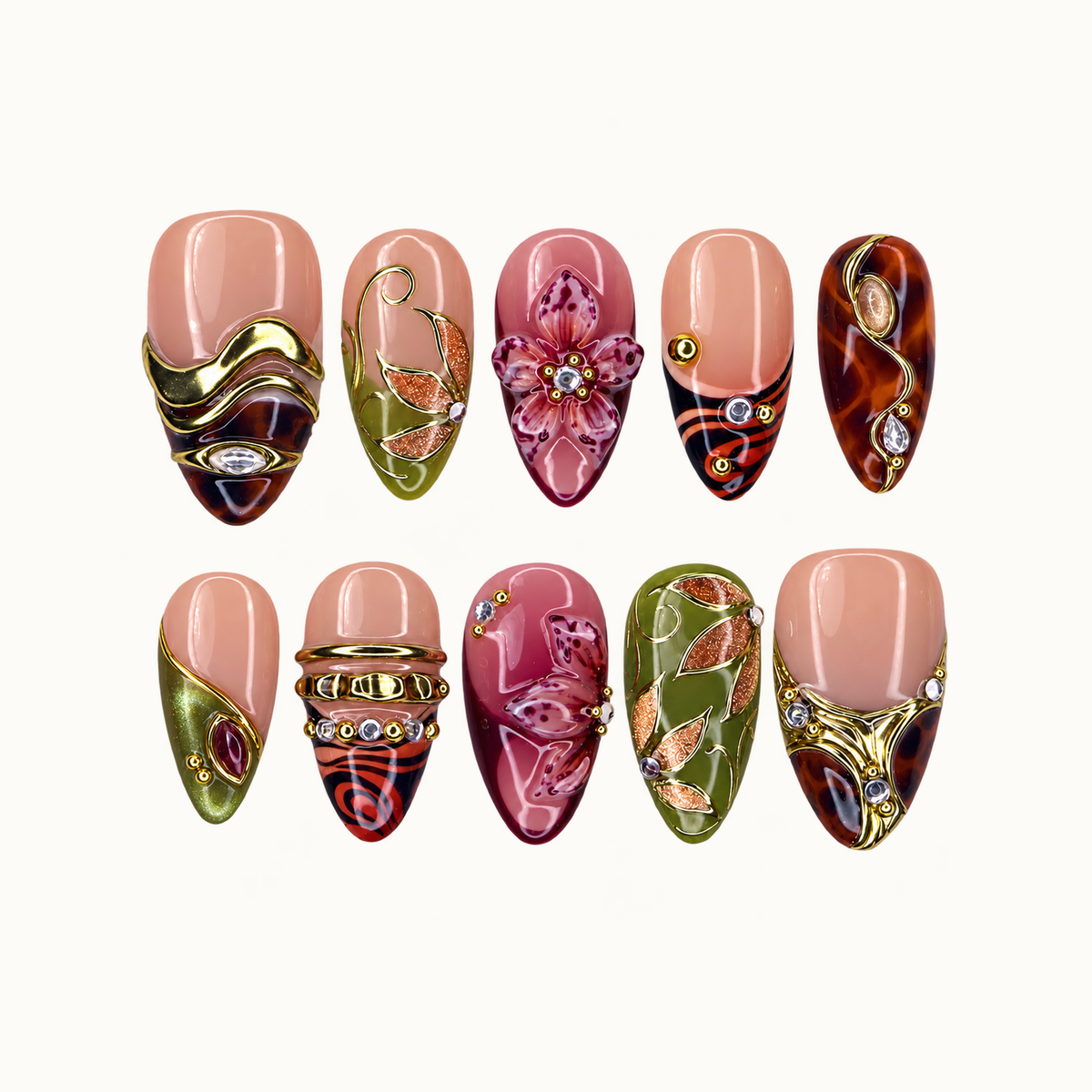 Ten coordinated nails arranged in two rows on a light background, featuring pink florals, olive leaves, amber patterns, and gold-toned accents.