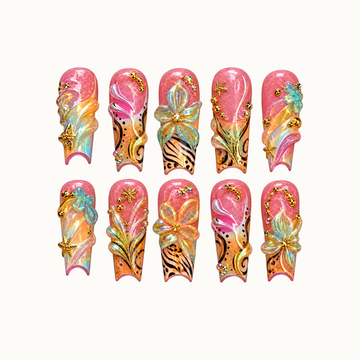 Ten coral-pink and peach nails arranged in two rows on a light neutral background, with raised flowers, aqua swirls, black patterns, and gold-toned starfish accents.