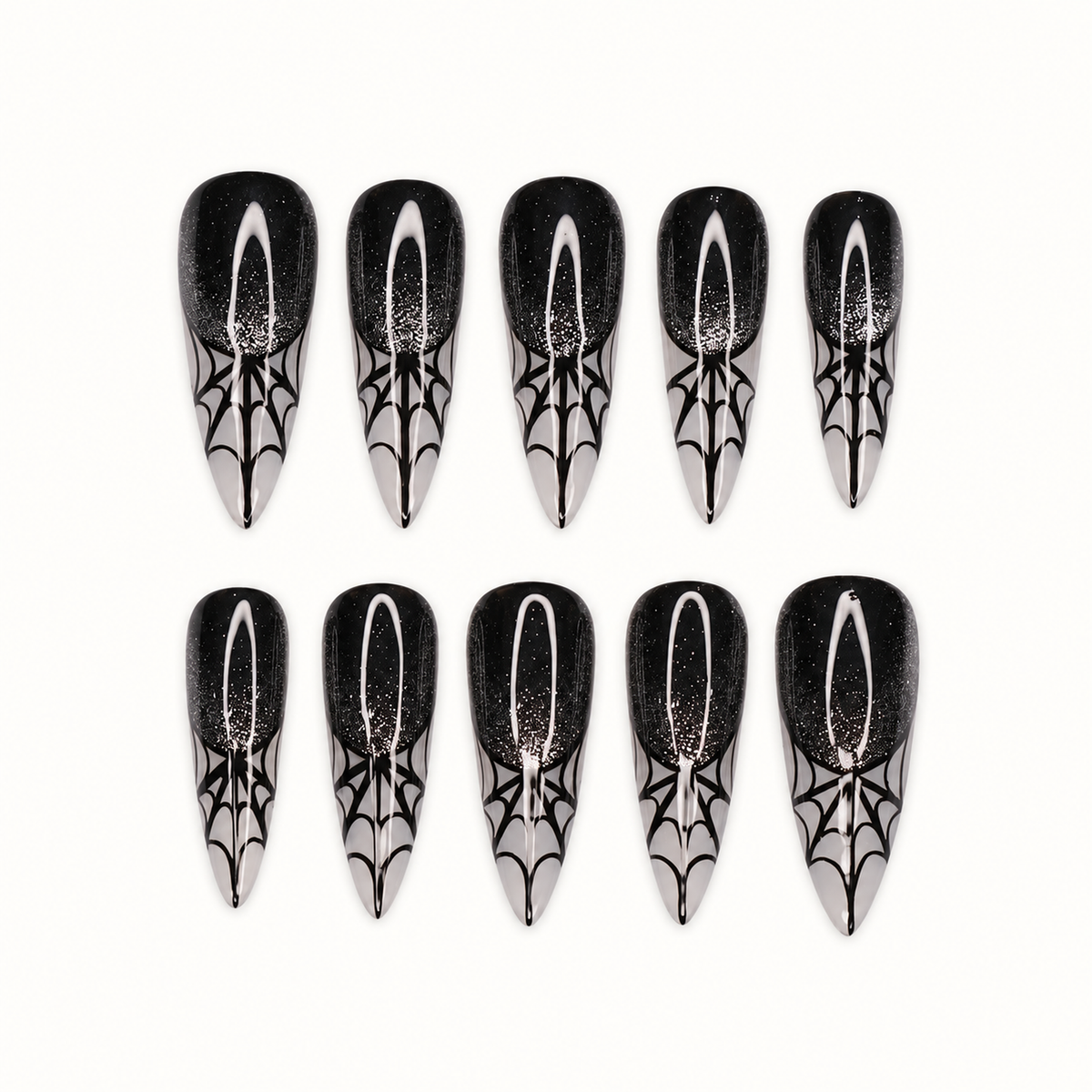 Ten glossy black press-on nails with subtle sparkle, silver-gray pointed tips, and black spiderweb designs on a light neutral background.