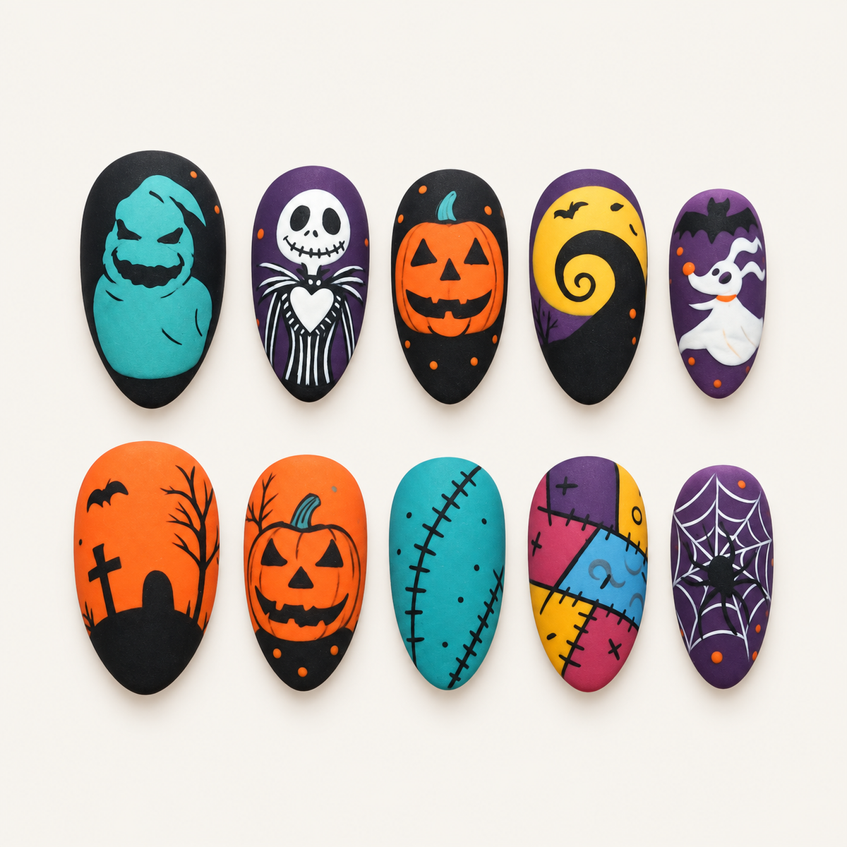 Ten coordinated Halloween press-on nails displayed in a clear case, with pumpkins, a ghost, spiderwebs, stitched patchwork, a moon swirl, bats, and graveyard art.