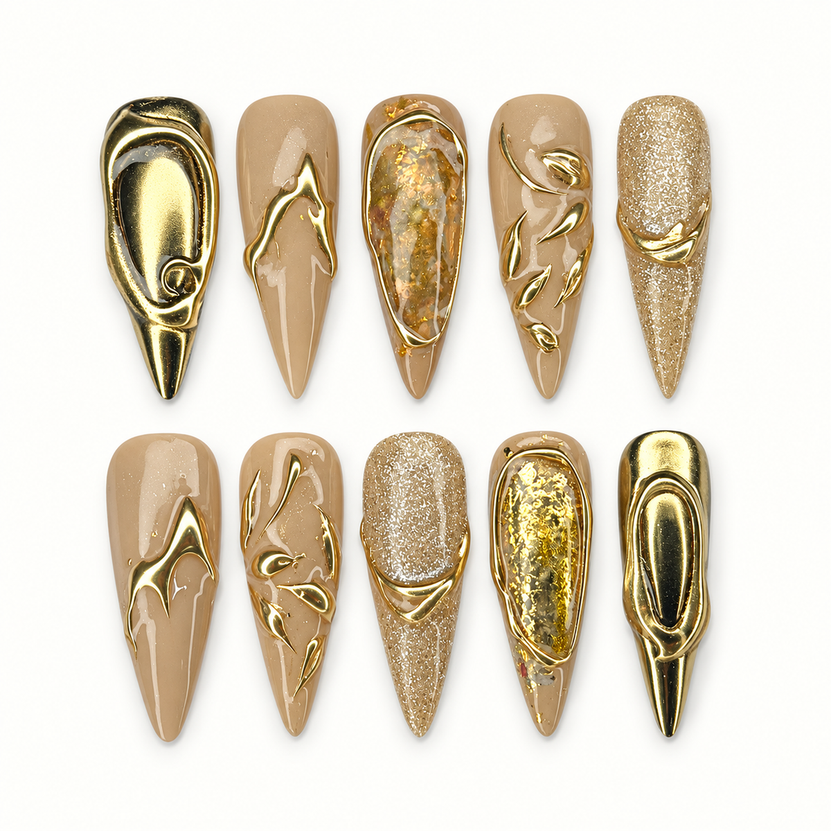 Ten coordinated stiletto press-on nails in milky beige, taupe, champagne glitter, and sculpted metallic gold accents.