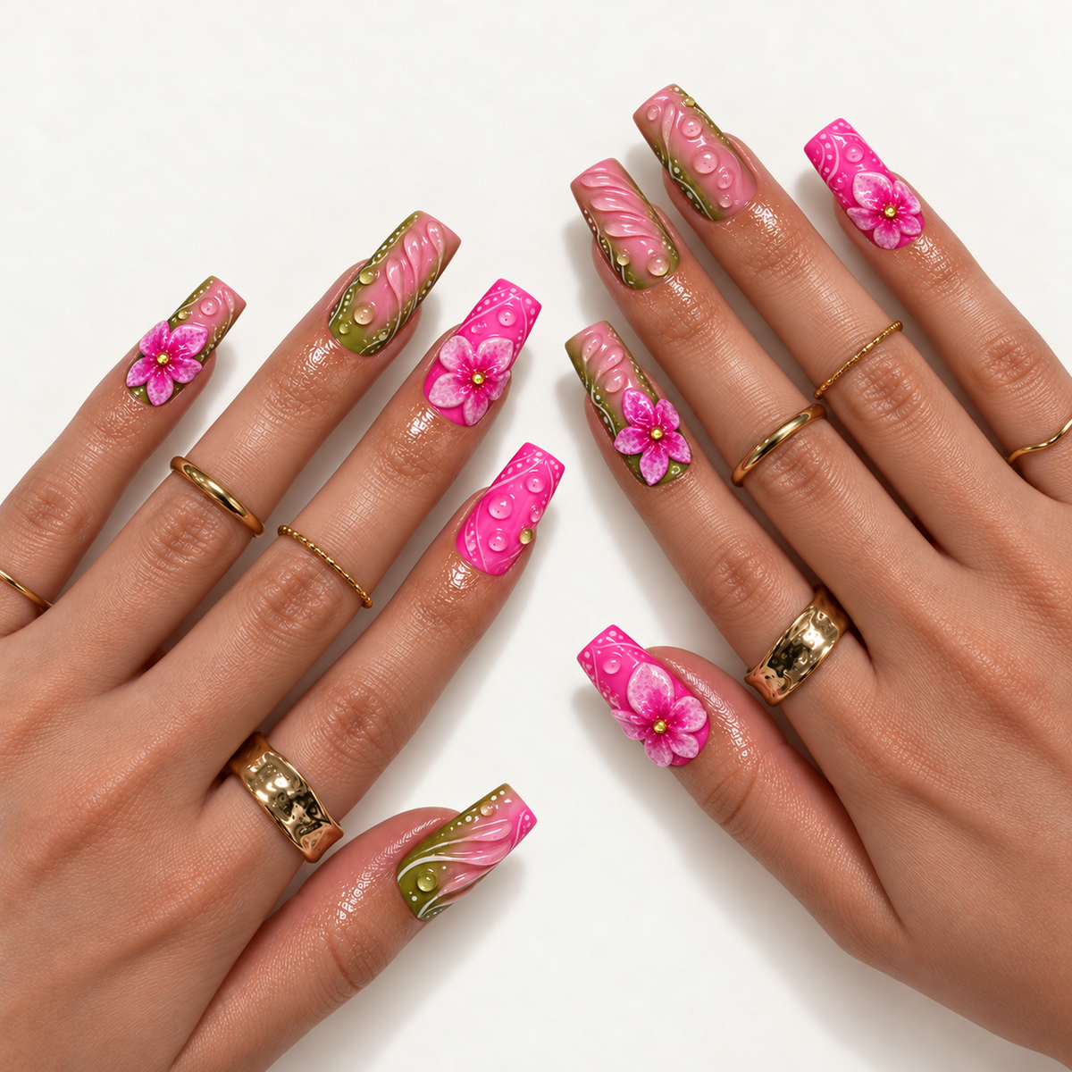 Hand model mockup showing pink and olive green floral nails with raised petals and dew-like details, styled with gold-tone rings.