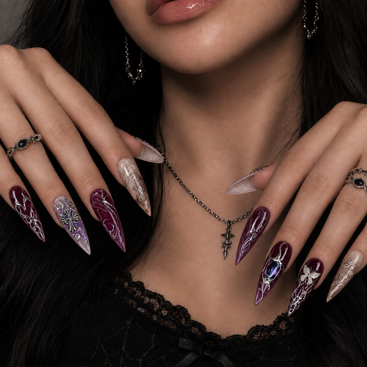 Amethyst Relic gothic purple press-on nails shown on a hand model, featuring silver-toned ornamental details.