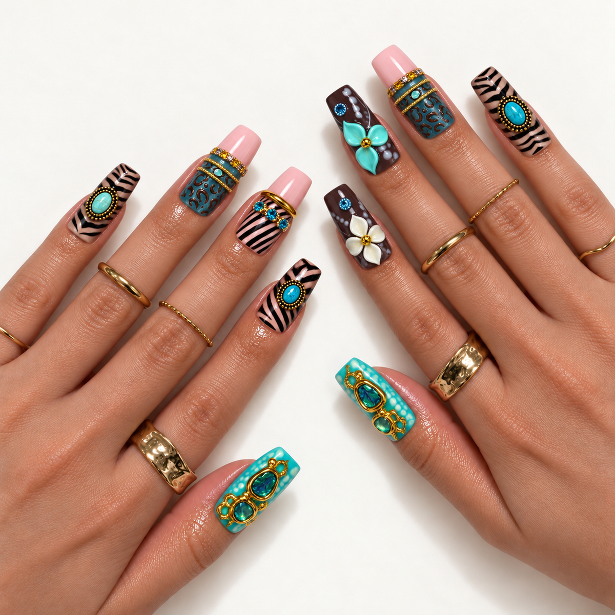 Hand model mockup showing the mixed turquoise, pink, and chocolate nail design with animal patterns, raised floral accents, and gold-tone embellishments.