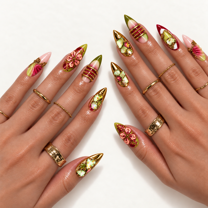 Two hands modeling pointed nails with berry-pink flowers, olive accents, reflective gold mosaics, and sculptural fan-like details.