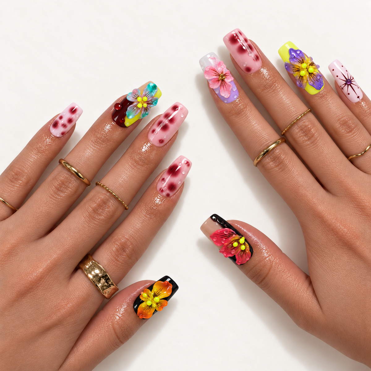 Hand model mockup displaying colorful raised floral nails, pink spotted accents, glossy droplets, and a pink starburst design with gold-tone rings.