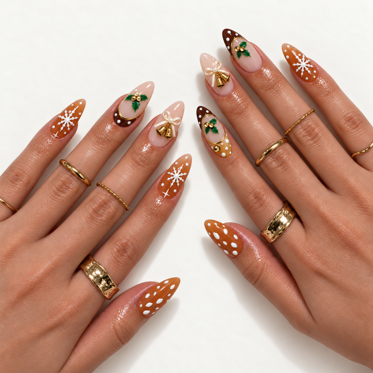 Hand model mockup showing the Christmas nail design with blush and brown accents, white snowflakes, green holly, ivory bows, and gold bells.