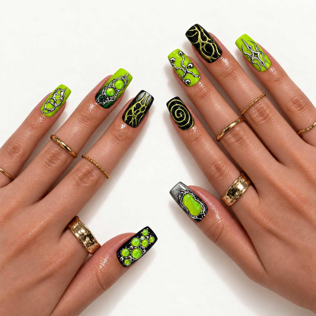 Hand model mockup showing lime and black nails with silver-toned ornamentation, green bubble accents, and a spiral, styled with gold-toned rings.