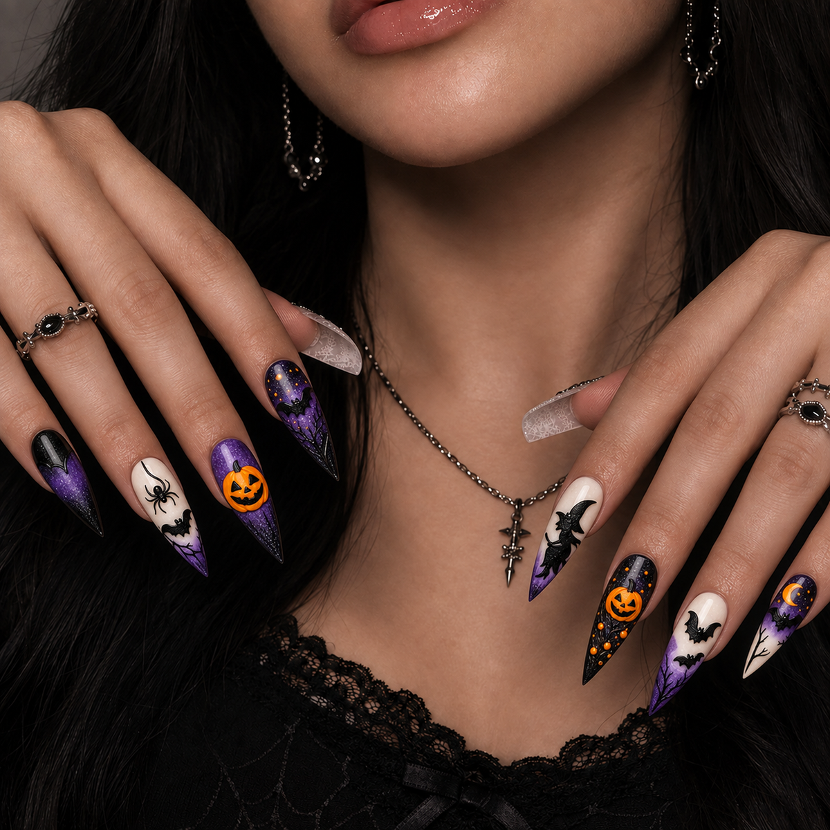 Midnight Pumpkin Spell press-on nails styled on a hand, showing purple shimmer, black bats, and orange pumpkin accents.