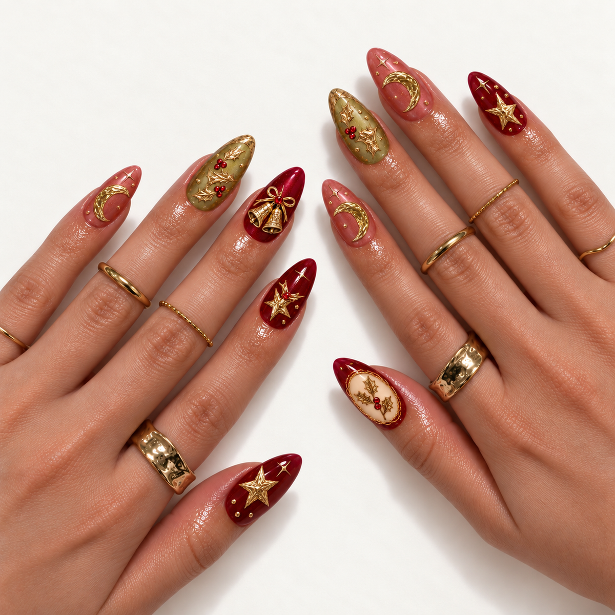 Hand model mockup showing the holiday nail design with burgundy stars and bells, olive holly accents, rose crescent moons, and an ivory holly panel.