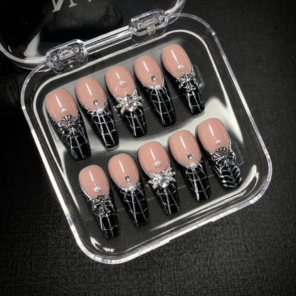 Silver Widow press-on nails displayed with Nail Handy open branded packaging.
