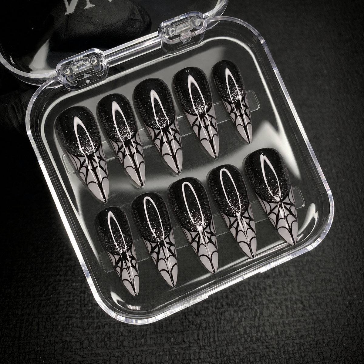 Open Nail Handy package displaying the Midnight Web press-on nail set and included contents.