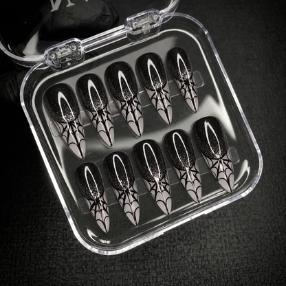 Open Nail Handy package displaying the Midnight Web press-on nail set and included contents.