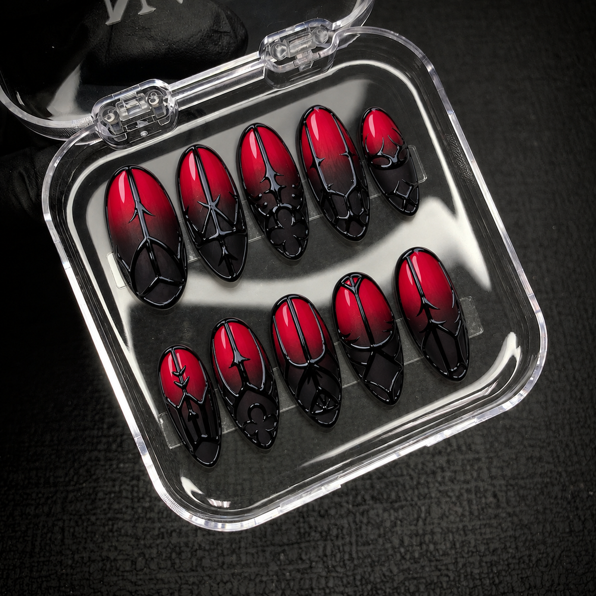 Open Nail Handy branded package displaying the Crimson Gate press-on nail set and included presentation materials.