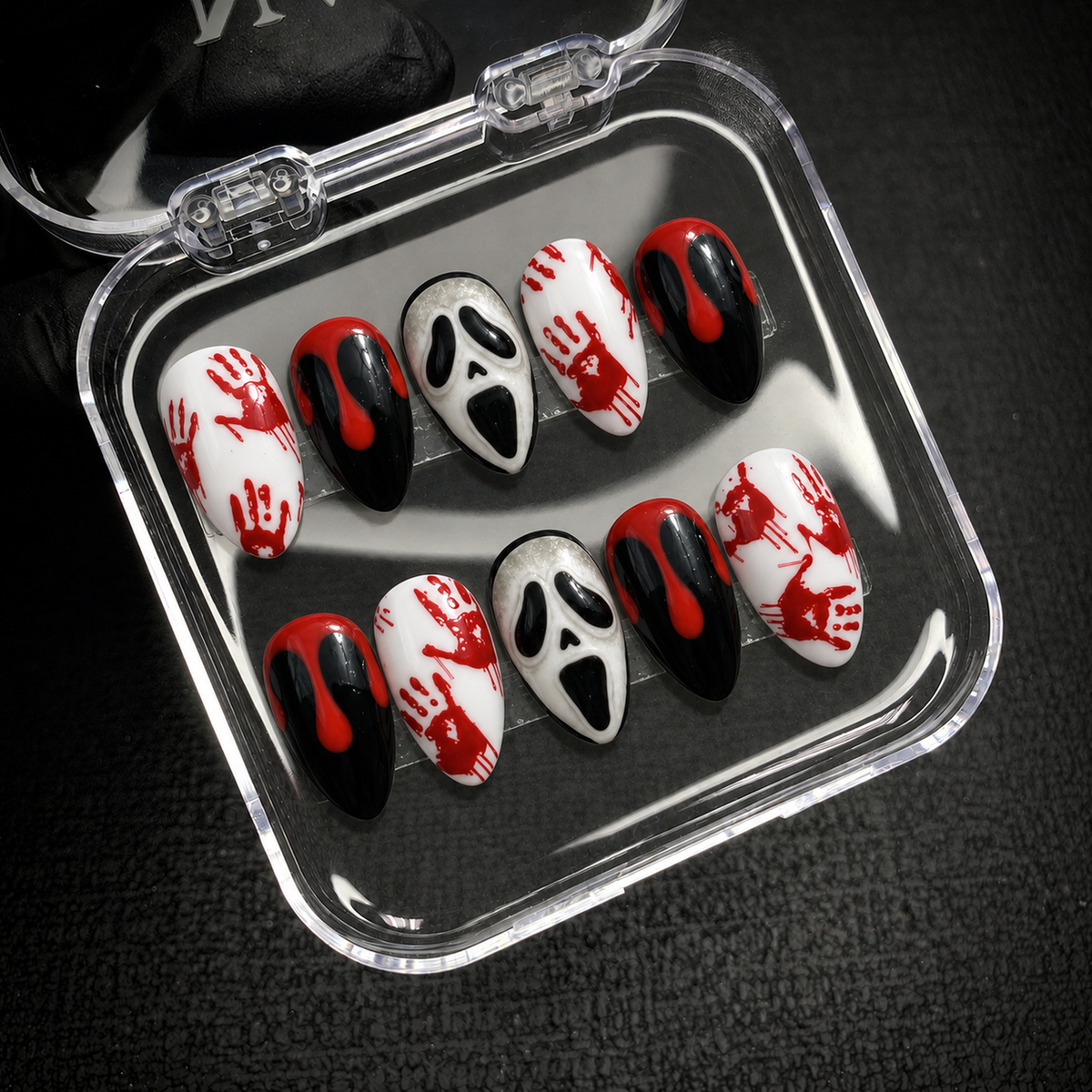 Open Nail Handy package displaying the Crimson Panic press-on nail set and included presentation contents.