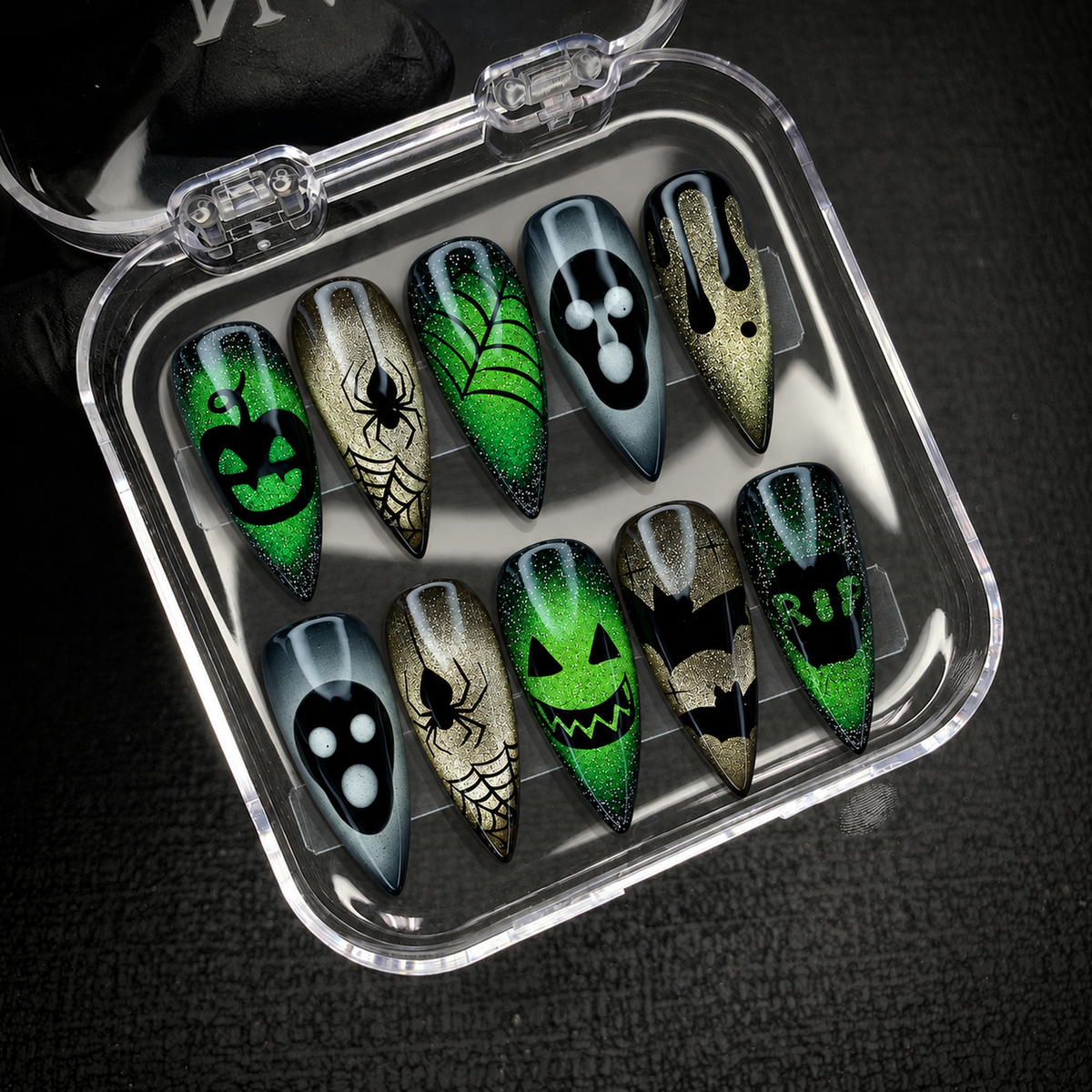 Open Nail Handy package box displaying the Venom Web Glow press-on nail set and included contents.