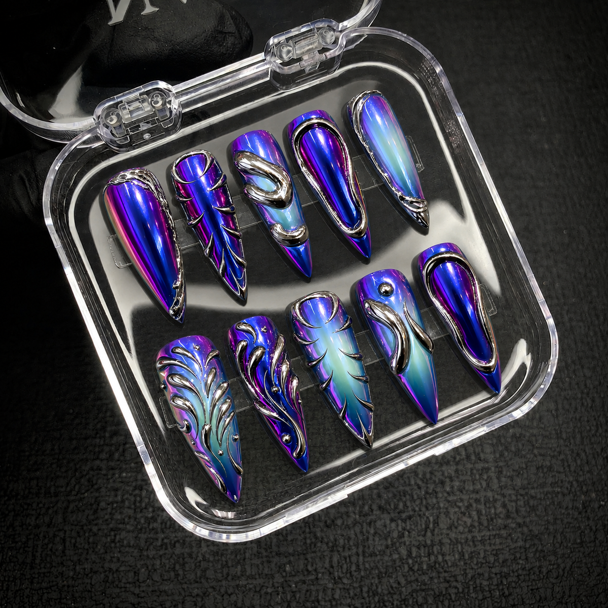 Open Nail Handy package displaying the Violet Liquid Metal press-on nail set and included contents.