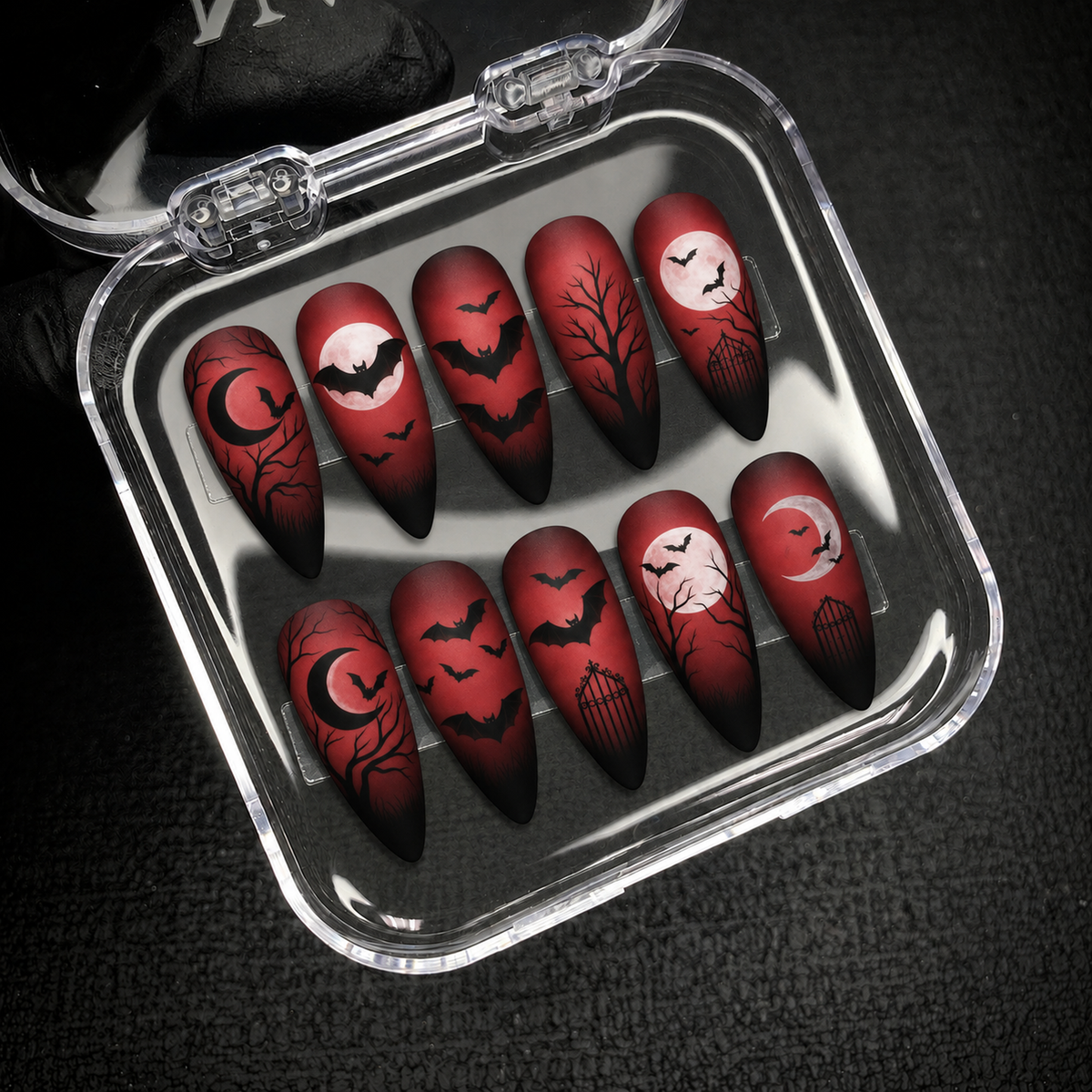 Open Nail Handy package presentation for the Crimson Moonflight gothic bat and moon press-on nail set.