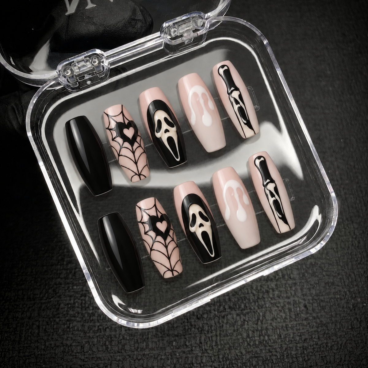 Open Nail Handy package showing the Webbed Noir press-on nail set and included contents