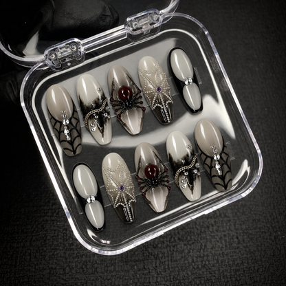 Open Nail Handy branded package displaying the Midnight Spider Web press-on nail set and included contents.
