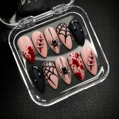 Open Nail Handy package displaying the Crimson Web press-on nail set and included contents.