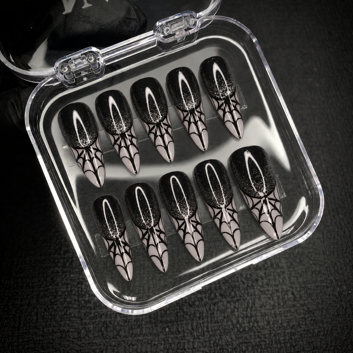 Open Nail Handy package displaying the Midnight Web press-on nail set.