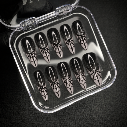 Open Nail Handy package displaying the Midnight Web press-on nail set.