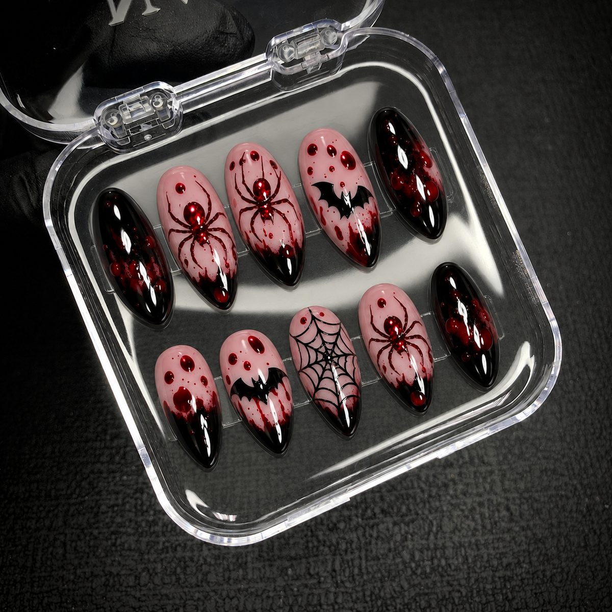 Open Nail Handy package displaying the Crimson Web press-on nail set and included contents.