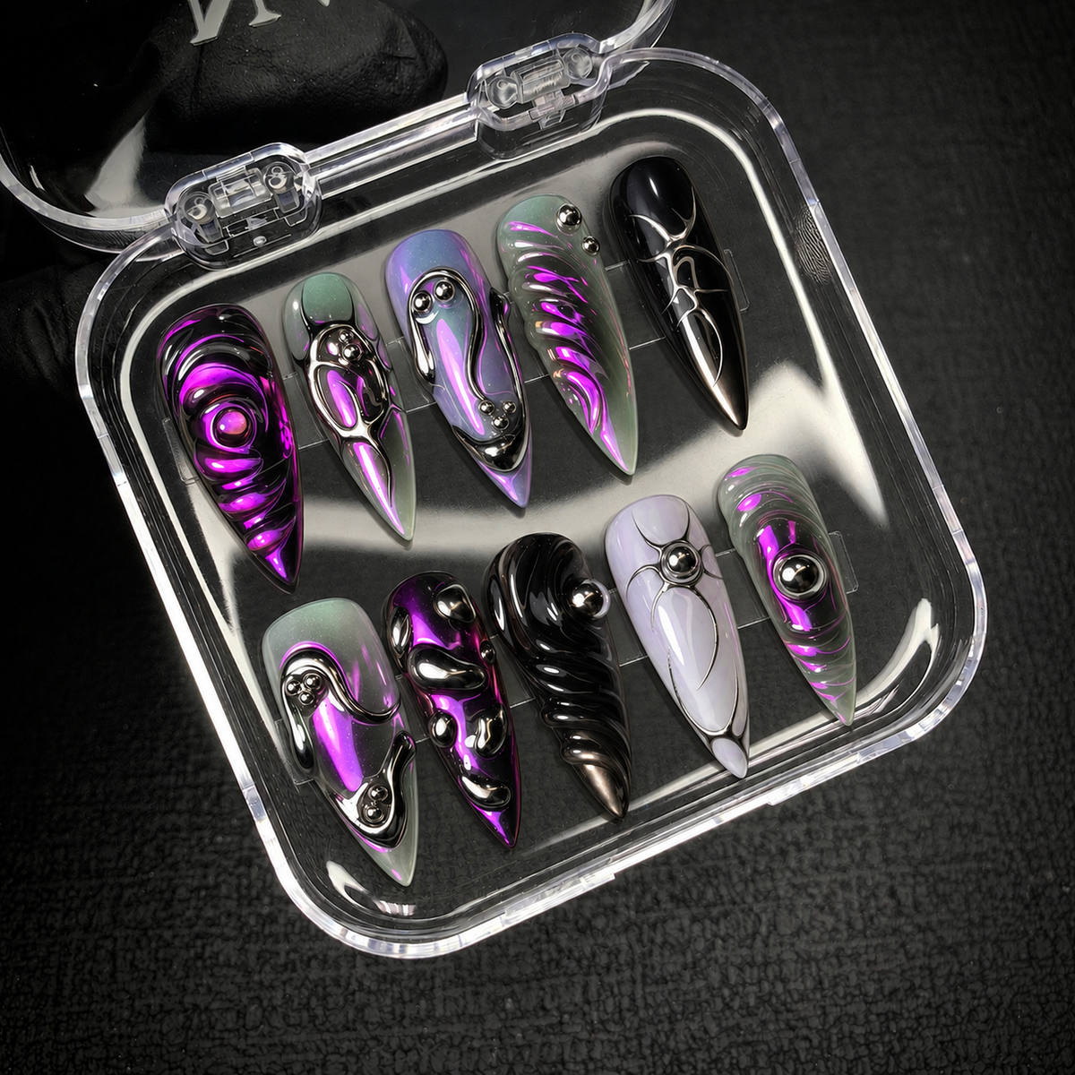 Open Nail Handy package presentation for the Violet Chrome Relic press-on nail set.