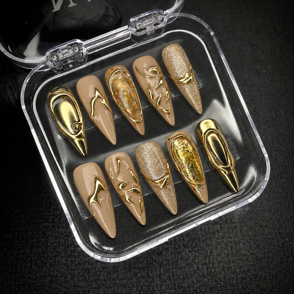 Milky Gold Bloom press-on nail set presented with an open Nail Handy package box.