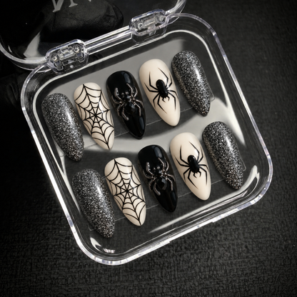 Silver Web Spider press-on nail set displayed with Nail Handy branded packaging open.