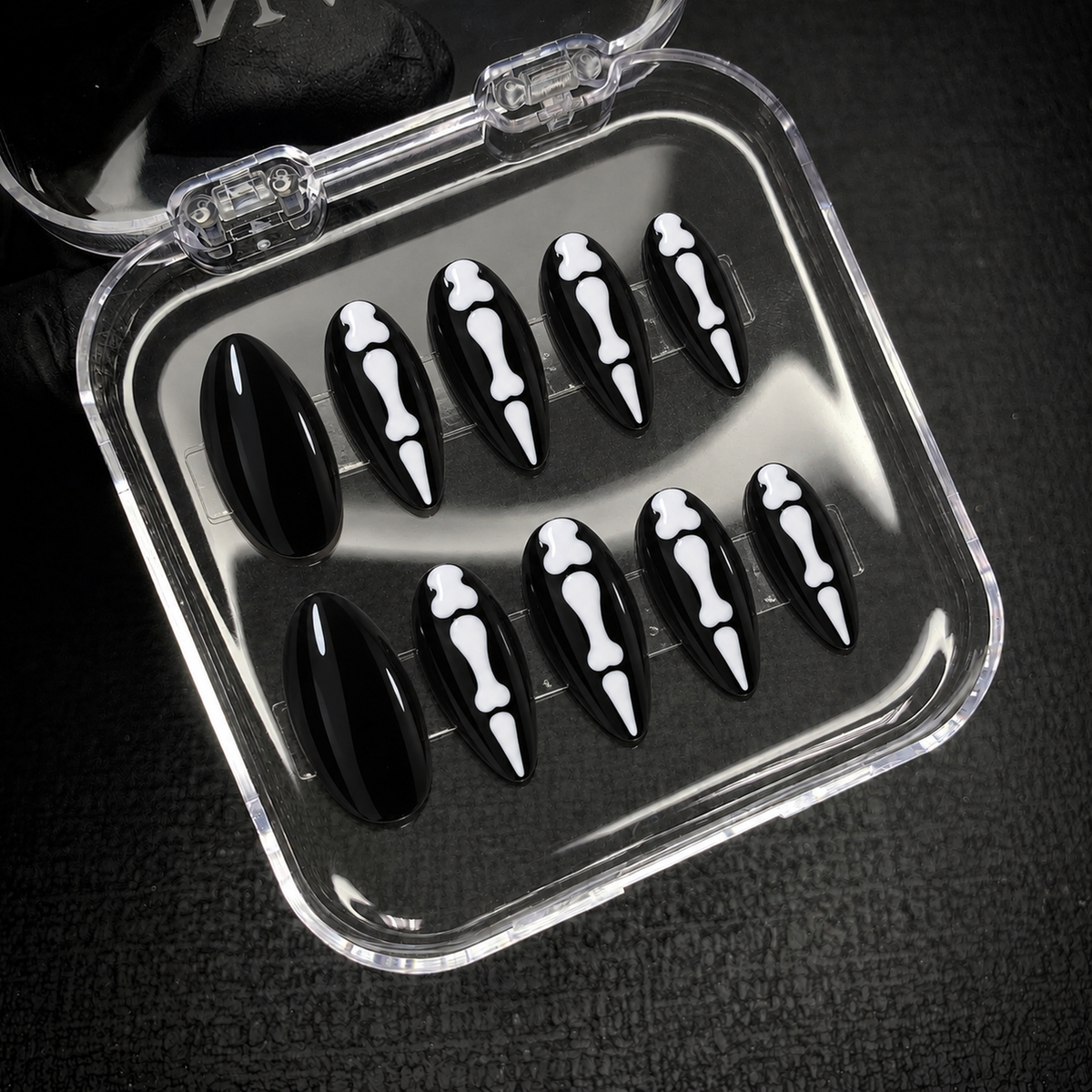 Open Nail Handy package box displaying the Midnight Bonework press-on nail set.