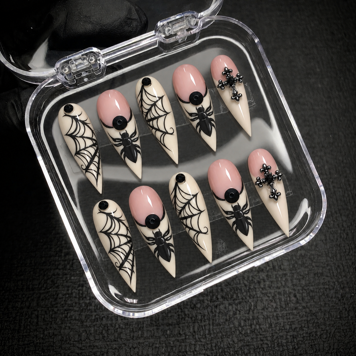 Open Nail Handy package displaying the Midnight Web Cross press-on nail set.
