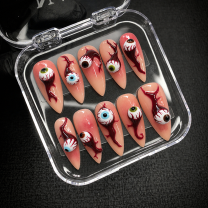 Open Nail Handy branded package displaying the Bloodshot Gaze press-on nail set and its included contents.