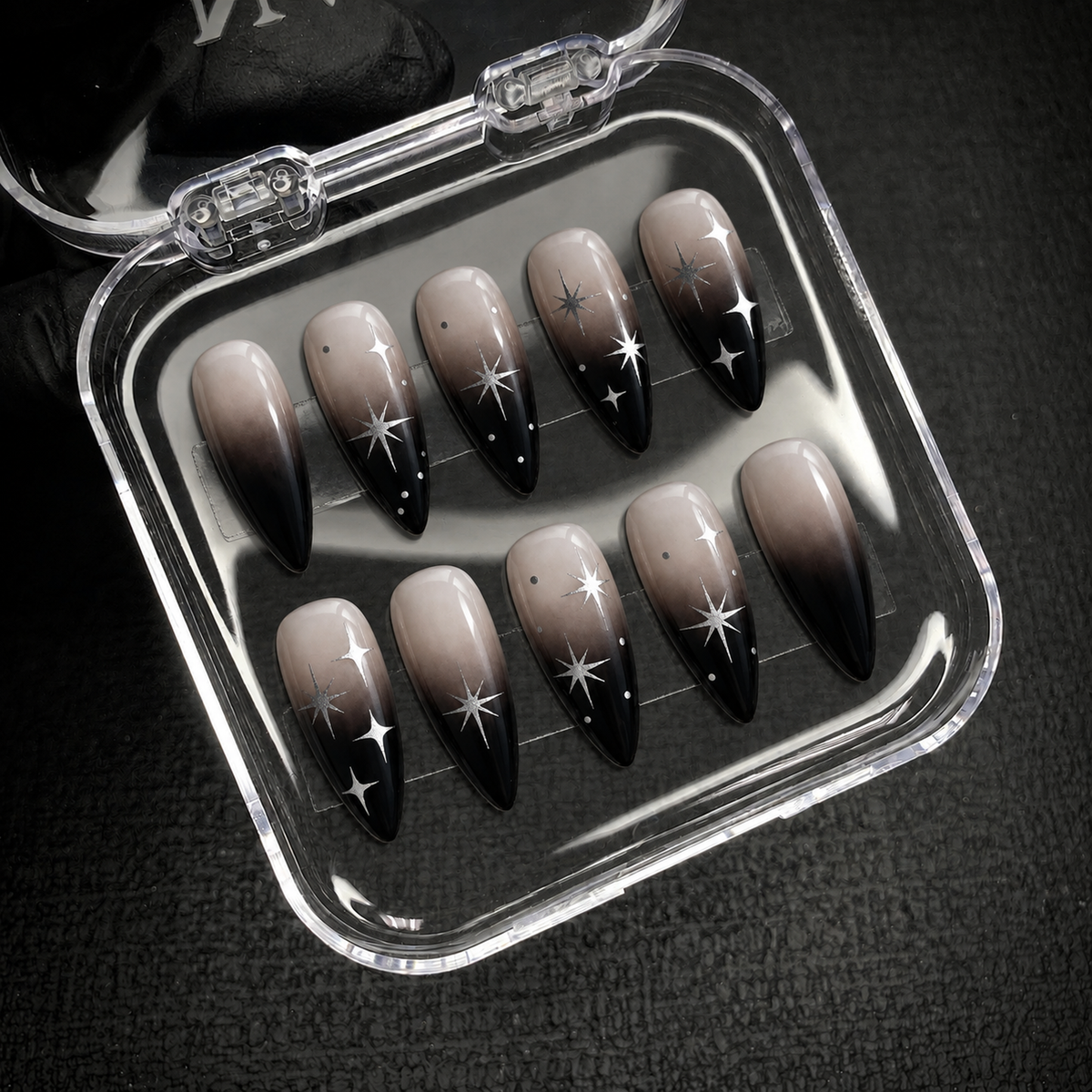 Open Nail Handy package presenting the Midnight Starfall press-on nail set.