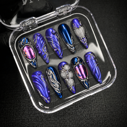 Open Nail Handy package box displaying the Chrome Nebula press-on nail set and included contents.
