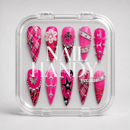 Pink Rebel Mix press-on nail set shown with Nail Handy branded package box.