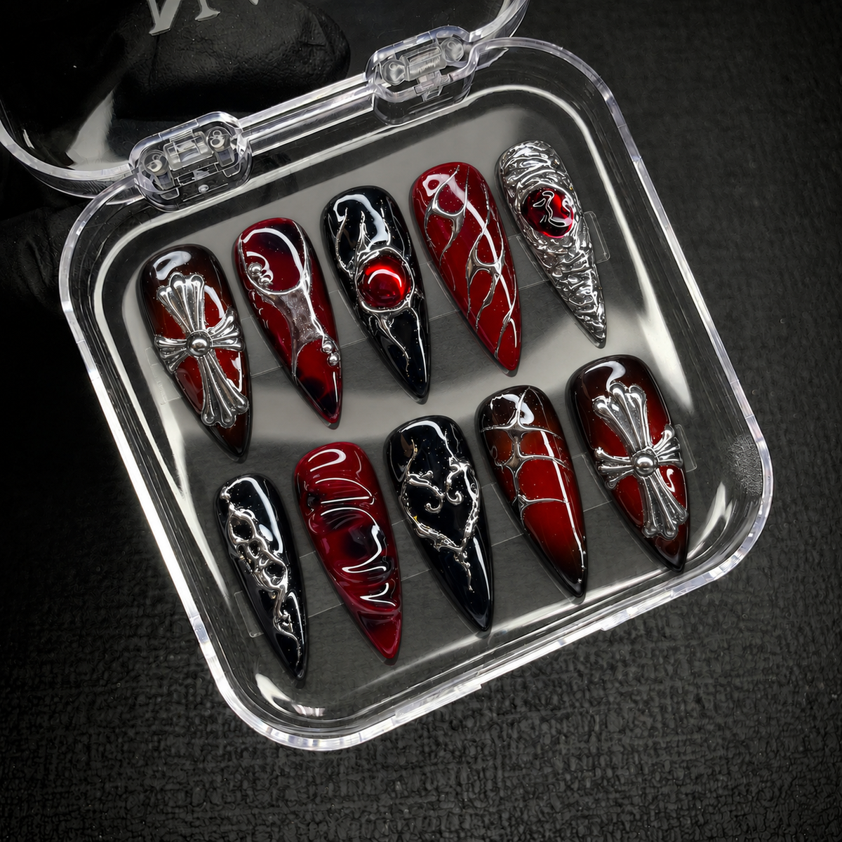 Crimson Reliquary press-on nail set displayed in an open Nail Handy package box.