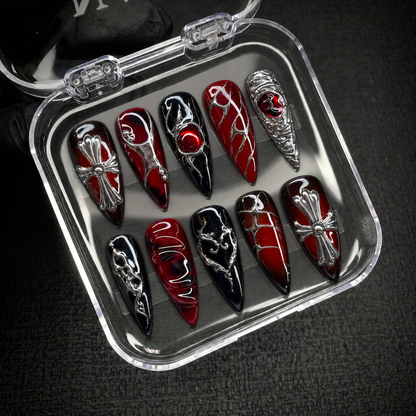 Crimson Reliquary press-on nail set displayed in an open Nail Handy package box.